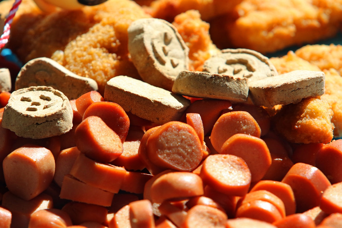 Pile of sliced hot dogs and chicken nuggets